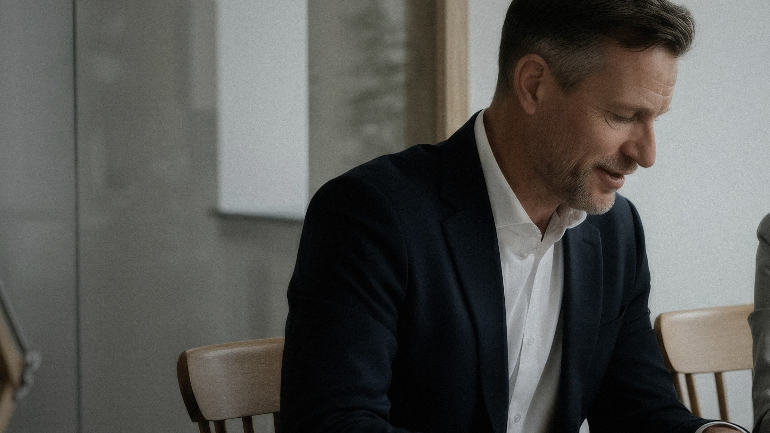 Professional reviewing evidence in a quiet meeting environment